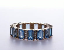 Load and play video in Gallery viewer, BLUE TOPAZ EMERALD CUT ETERNITY RING 14K Gold
